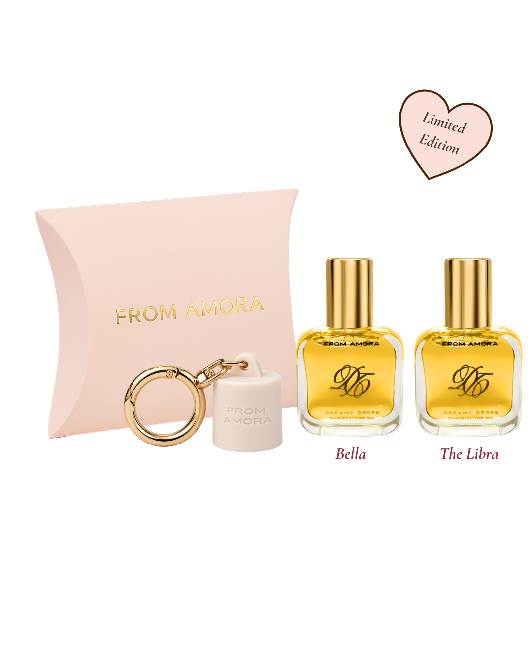 A fragrance gift set from FROM AMORA on a white background, featuring a pale pink pillow box, a small white keychain, and two gold-capped perfume bottles labeled Bella and The Libra, with a pink 'Limited Edition' heart graphic.